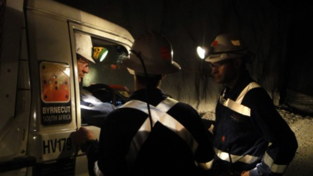 Miners talking in Underground Mining project