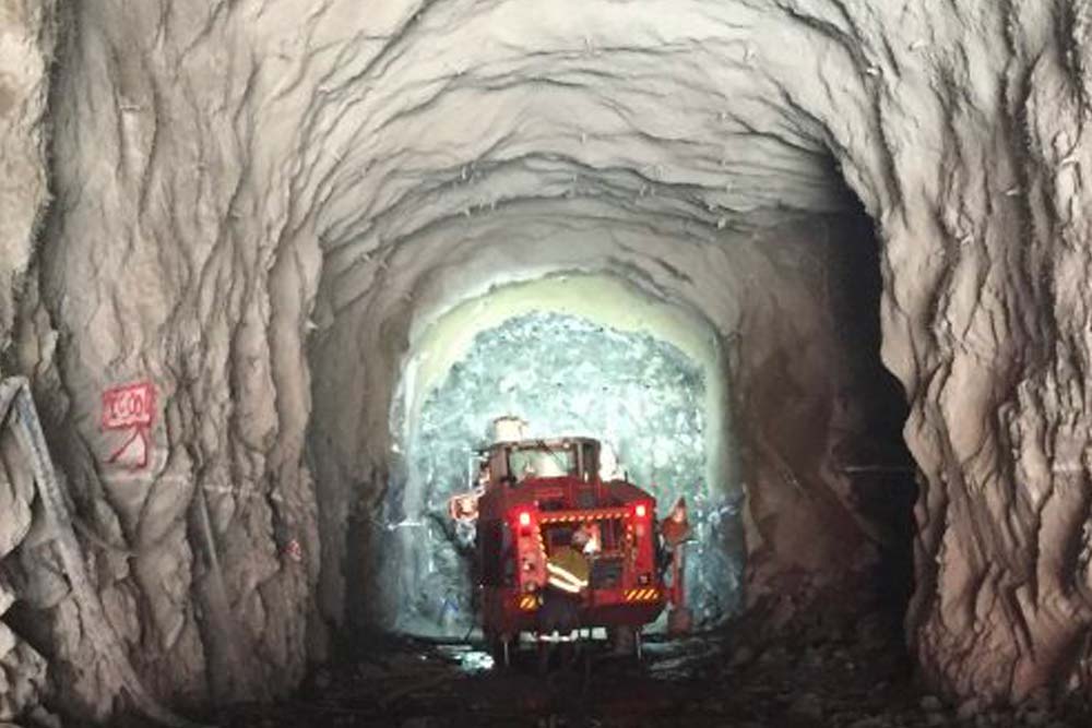 Truck driving underground in tunnel