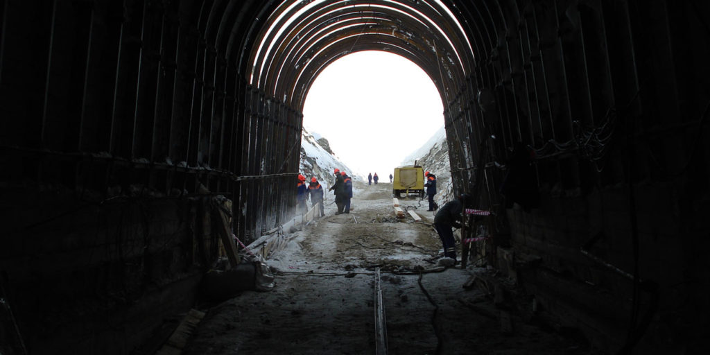 Miners working in the tunnel, Byrnecut Voskhod Chromite Project, Kazakhstan